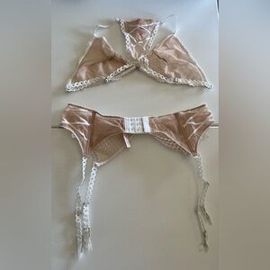Brand new with tag unlined Victoria secret bra and garter belt